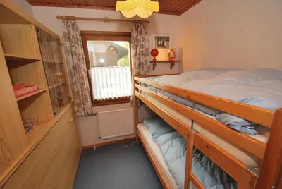 Ein Bett oder Betten in einem Zimmer der Unterkunft Ferienhaus Kamin