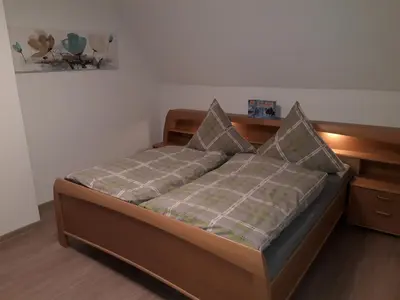 Ein Bett oder Betten in einem Zimmer der Unterkunft Ferienhaus am Riesenberg