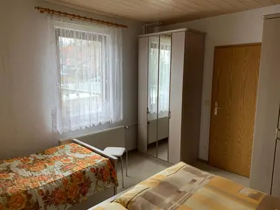Ein Bett oder Betten in einem Zimmer der Unterkunft Ferienwohnungen Rießling