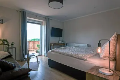 Ein Bett oder Betten in einem Zimmer der Unterkunft Ferienwohnungen Harzblick