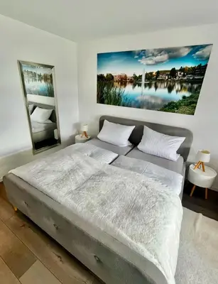 Ein Bett oder Betten in einem Zimmer der Unterkunft Seeblickapp. „Eure Auszeit“