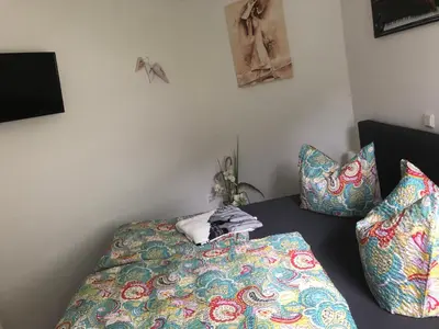 Ein Bett oder Betten in einem Zimmer der Unterkunft Karins Ferienwohnung
