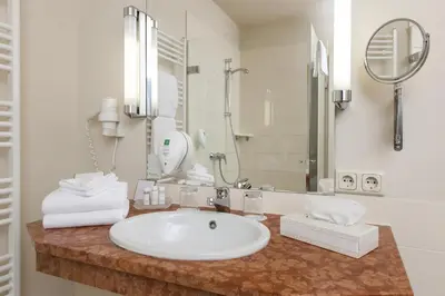 Ein Badezimmer in der Unterkunft Wyndham Garden Quedlinburg Stadtschloss