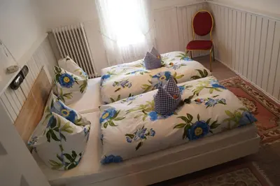 Ein Bett oder Betten in einem Zimmer der Unterkunft Pension Jagdhütte