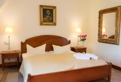 Ein Bett oder Betten in einem Zimmer der Unterkunft Schlosshotel zum Markgrafen