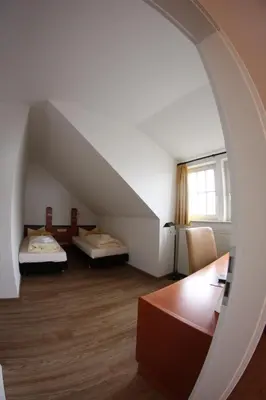 Ein Bett oder Betten in einem Zimmer der Unterkunft Hotel Goldene Krone