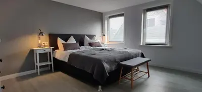Ein Bett oder Betten in einem Zimmer der Unterkunft Großes schönes Ferienhaus mit Garten für 12 Personen erwartet Sie im Harz!