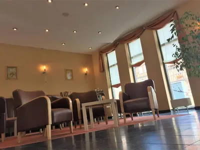 Ein Sitzbereich in der Unterkunft Hotel Ambiente