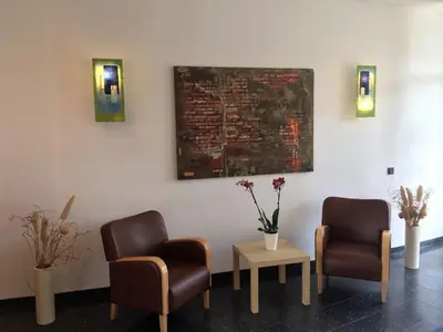 Ein Sitzbereich in der Unterkunft Hotel Ambiente