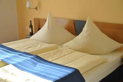Ein Bett oder Betten in einem Zimmer der Unterkunft Hotel Ambiente