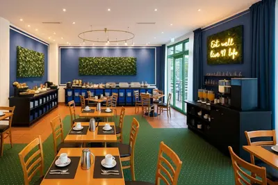 Ein Restaurant oder anderes Speiselokal in der Unterkunft Acron-Hotel Quedlinburg