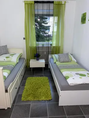 Ein Bett oder Betten in einem Zimmer der Unterkunft International 4