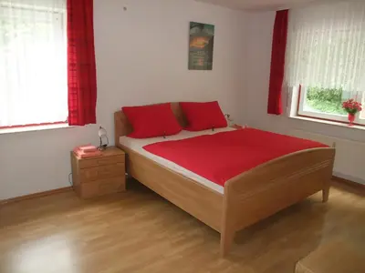 Ein Bett oder Betten in einem Zimmer der Unterkunft Ferienhaus Hubertus in Elend mit Balkons