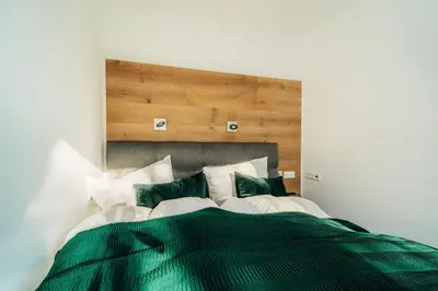 Ein Bett oder Betten in einem Zimmer der Unterkunft Fichte