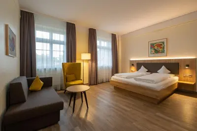 Ein Bett oder Betten in einem Zimmer der Unterkunft Hotel Niedersächsischer Hof