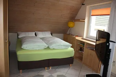 Ein Bett oder Betten in einem Zimmer der Unterkunft FEWO Wittig