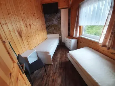 Ein Bett oder Betten in einem Zimmer der Unterkunft Ferienhäuser in Allrode