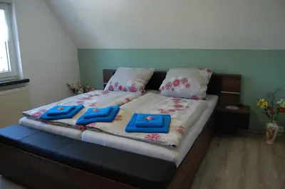 Ein Bett oder Betten in einem Zimmer der Unterkunft Ferienwohnung Hertha