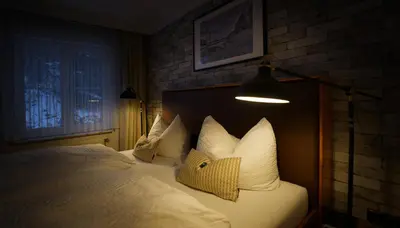 Ein Bett oder Betten in einem Zimmer der Unterkunft Hotel Grüne Tanne Mandelholz