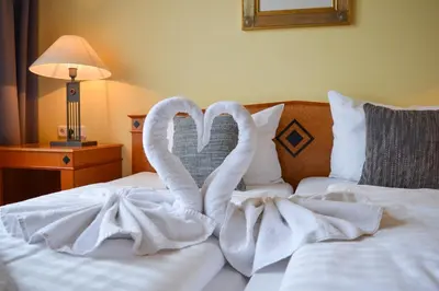 Ein Bett oder Betten in einem Zimmer der Unterkunft CAREA Residenz Hotel Harzhöhe