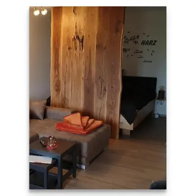 Ein Bett oder Betten in einem Zimmer der Unterkunft Harz Zeit