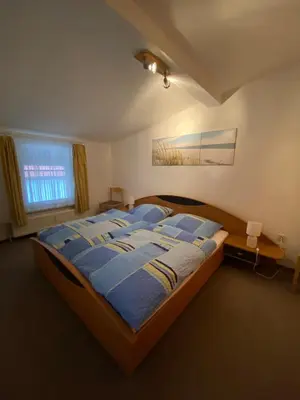 Ein Bett oder Betten in einem Zimmer der Unterkunft Ferienwohnung Waschinski