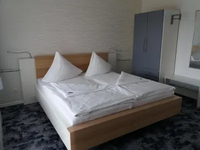 Ein Bett oder Betten in einem Zimmer der Unterkunft Hotel Garni Waldsegler
