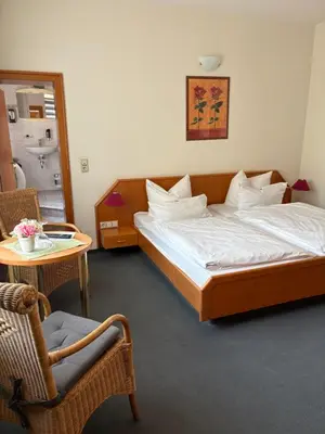Ein Bett oder Betten in einem Zimmer der Unterkunft Hotel-Pension Bergkranz