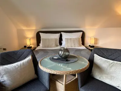 Ein Sitzbereich in der Unterkunft Haus Im Arnikagrund - Ferienwohnung & Privatzimmer