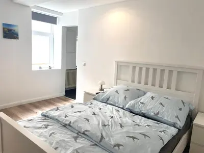 Ein Bett oder Betten in einem Zimmer der Unterkunft Ferienwohnung Wasserkunst 2