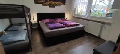Ein Bett oder Betten in einem Zimmer der Unterkunft Ferienwohnung Sagenwelt