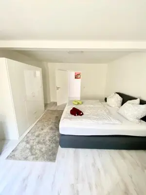 Ein Bett oder Betten in einem Zimmer der Unterkunft Ferienwohnungen Rosentor Goslar Zentrum 180qm & 300qm