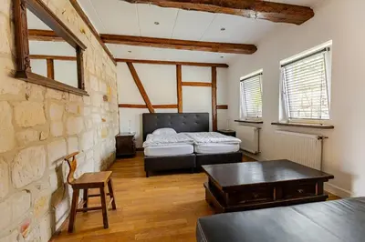 Ein Bett oder Betten in einem Zimmer der Unterkunft Mario's fachwerkhaus am Huy