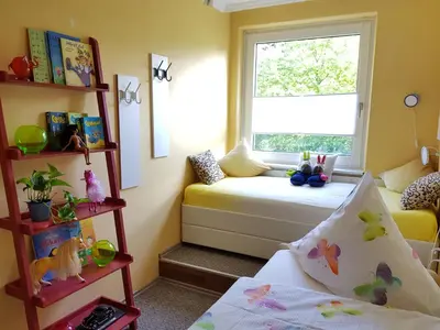 Ein Bett oder Betten in einem Zimmer der Unterkunft Grossdorf Ferienwohnung Waldsuite im Harz