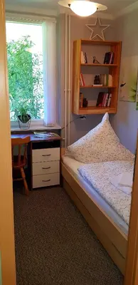 Ein Bett oder Betten in einem Zimmer der Unterkunft Grossdorf Ferienwohnung Waldsuite im Harz