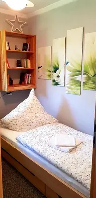 Ein Bett oder Betten in einem Zimmer der Unterkunft Grossdorf Ferienwohnung Waldsuite im Harz