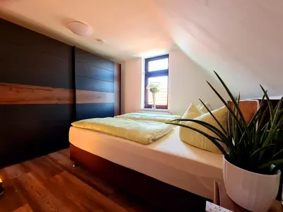 Ein Bett oder Betten in einem Zimmer der Unterkunft Ferienhaus Heider