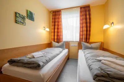 Ein Bett oder Betten in einem Zimmer der Unterkunft Hotelpark Bodetal mit Ferienwohnungen