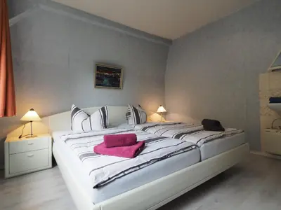 Ein Bett oder Betten in einem Zimmer der Unterkunft Apartments Carmen