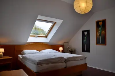 Ein Bett oder Betten in einem Zimmer der Unterkunft Ferienwohnung An der Försterei