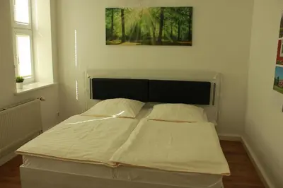 Ein Bett oder Betten in einem Zimmer der Unterkunft Ferienwohnung Altstadtdomizil