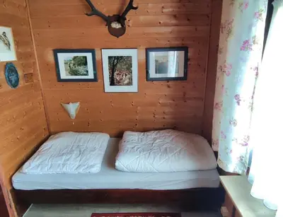 Ein Bett oder Betten in einem Zimmer der Unterkunft Ferienblockhaus Harzidyll