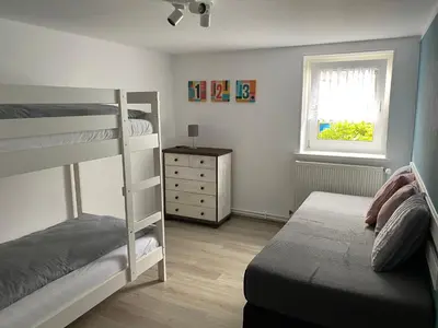 Ein Bett oder Betten in einem Zimmer der Unterkunft Ferienwohnung Hohensee EG