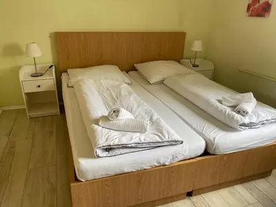 Ein Bett oder Betten in einem Zimmer der Unterkunft Hotel PB