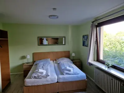 Ein Bett oder Betten in einem Zimmer der Unterkunft Hotel PB