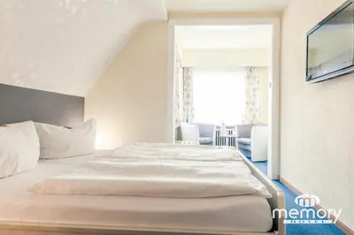 Ein Bett oder Betten in einem Zimmer der Unterkunft Memory Hotel