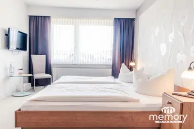 Ein Bett oder Betten in einem Zimmer der Unterkunft Memory Hotel