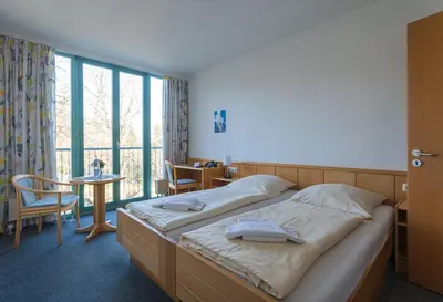 Ein Bett oder Betten in einem Zimmer der Unterkunft CVJM Familienferienstätte Huberhaus