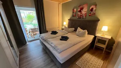 Ein Bett oder Betten in einem Zimmer der Unterkunft Ferienwohnung Wetzig W1 - Breite Straße 104 Wernigerode