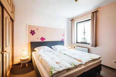 Ein Bett oder Betten in einem Zimmer der Unterkunft Landhotel Alte Aue